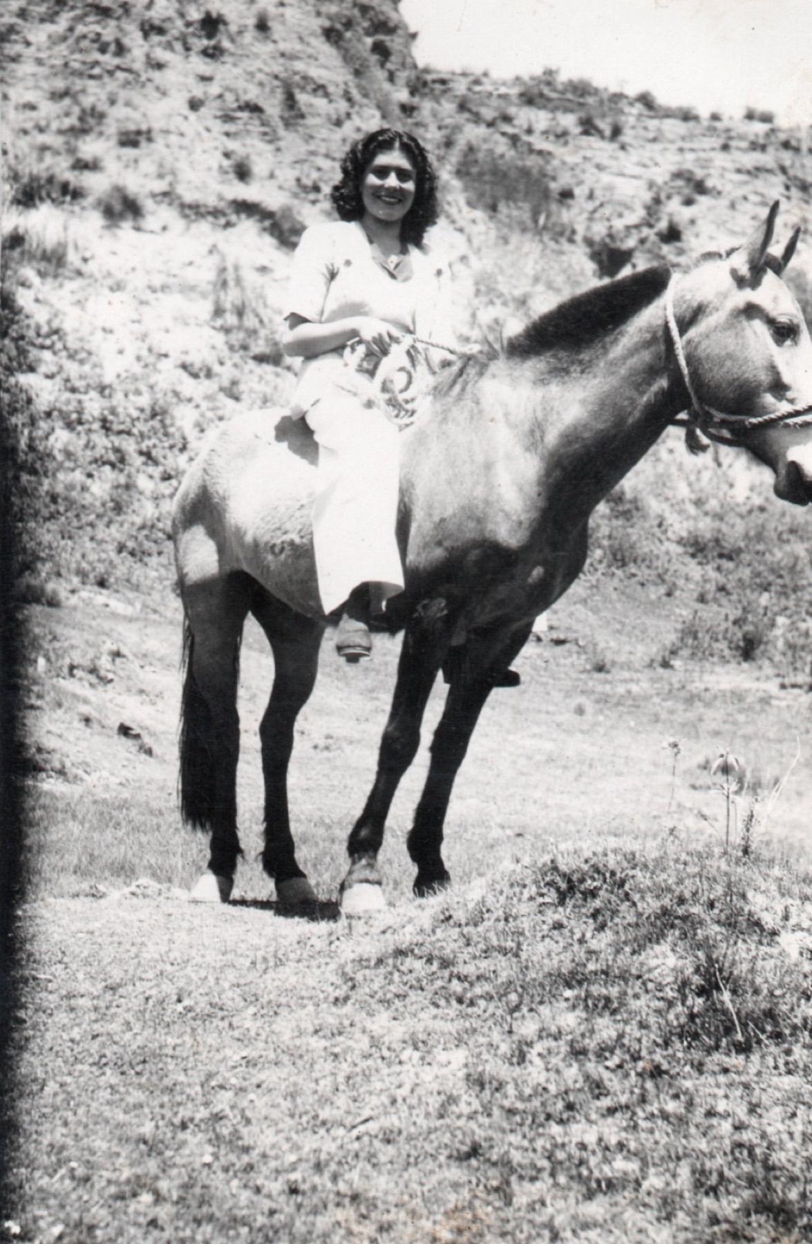 Delia Vidal on horseback in the mountains