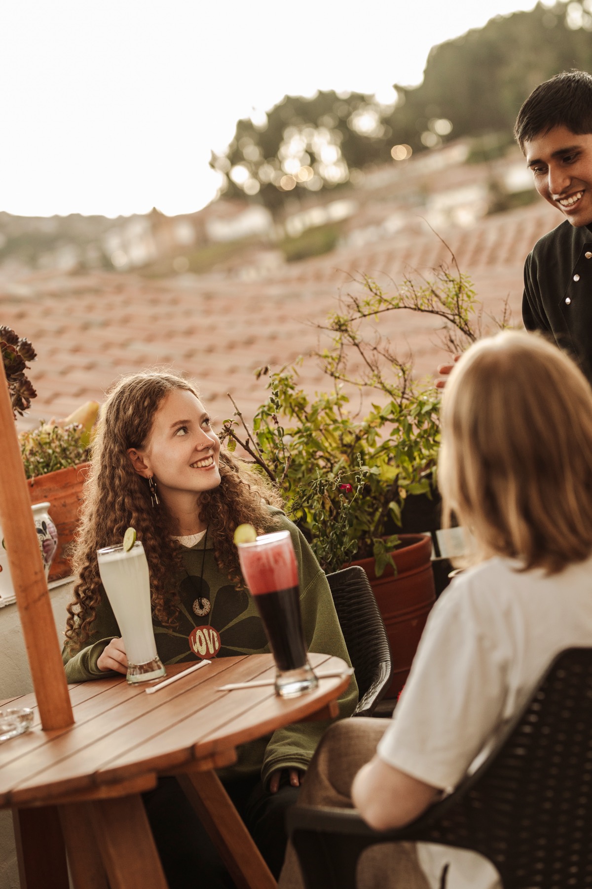 Guests chatting with the team on the terrace