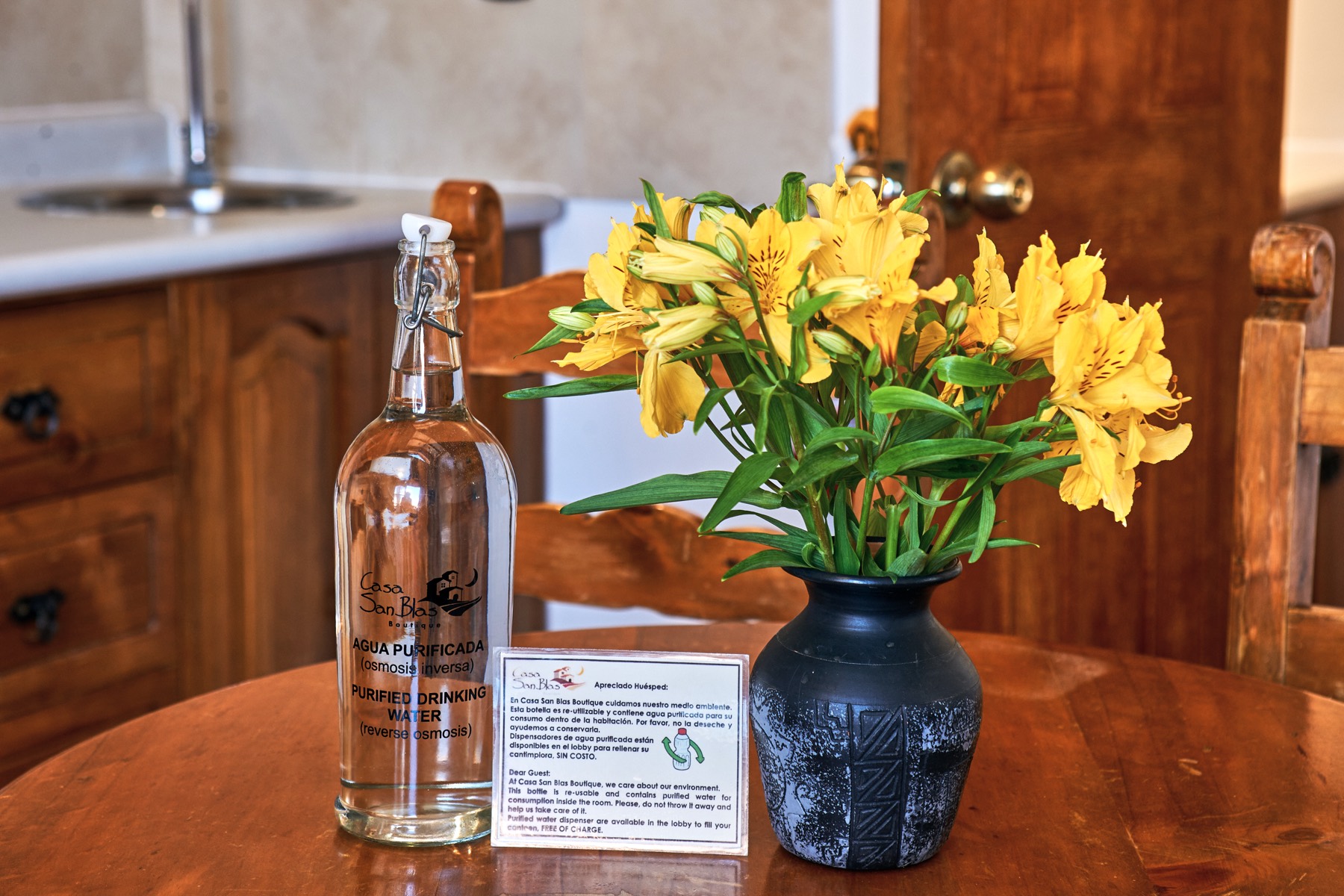 Purified water bottle and flowers in a room